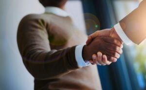 two men shaking hands